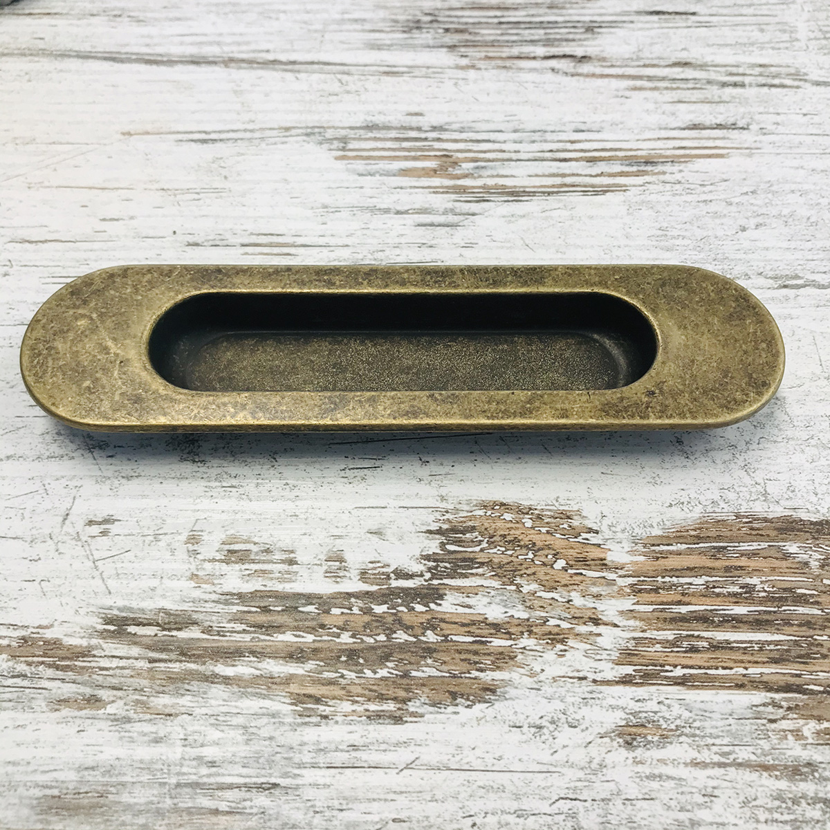 Castella Dune Oval Flush Pull - Antique Brass