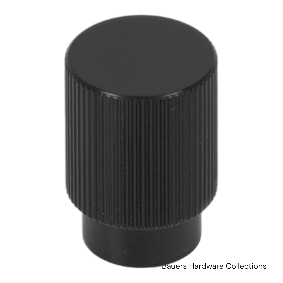 Charlotte cabinet knob in brushed black finish installed on a modern kitchen cabinet door